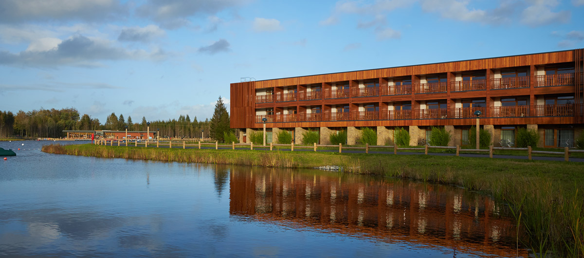 exterior of apartments in front of lake