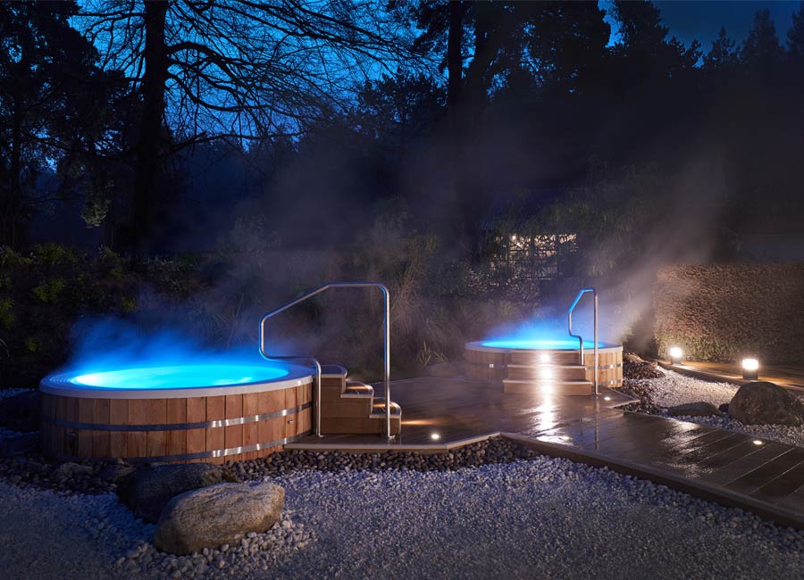 outdoor hot tubs at night time 