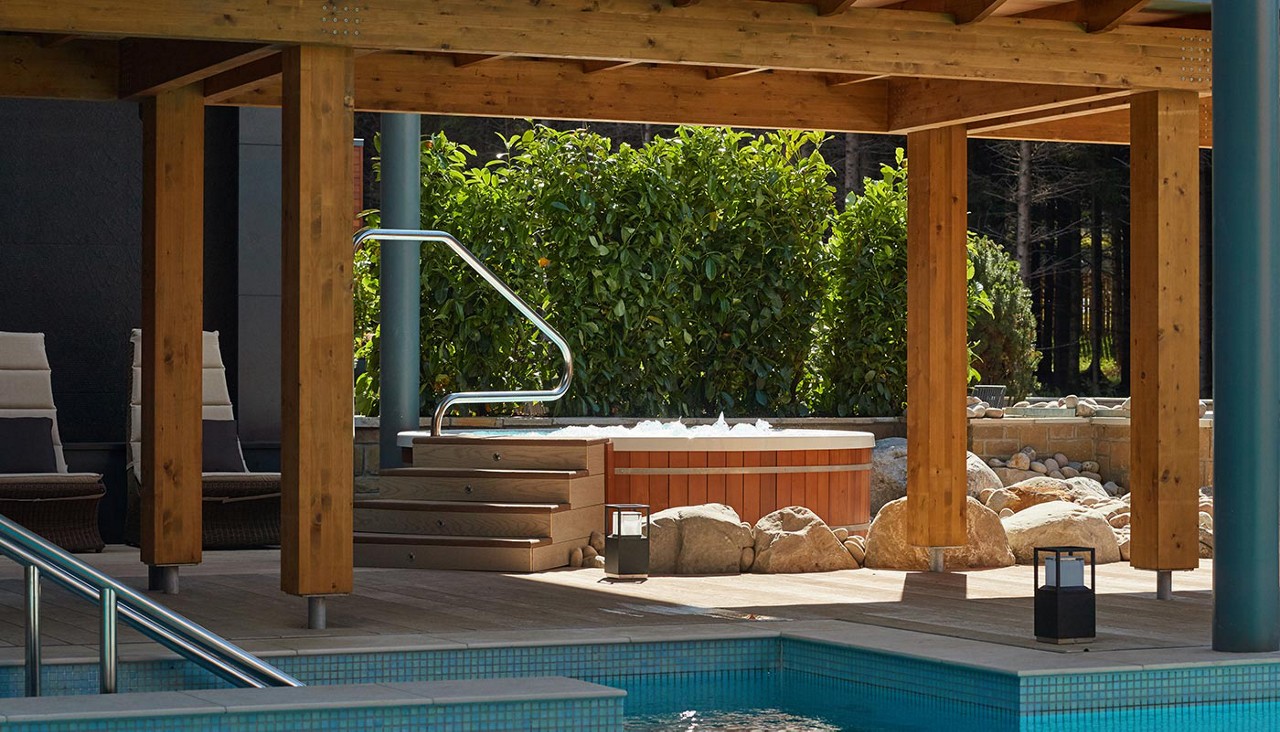 Bubbling outdoor Hot Tubs surrounded by the forest.