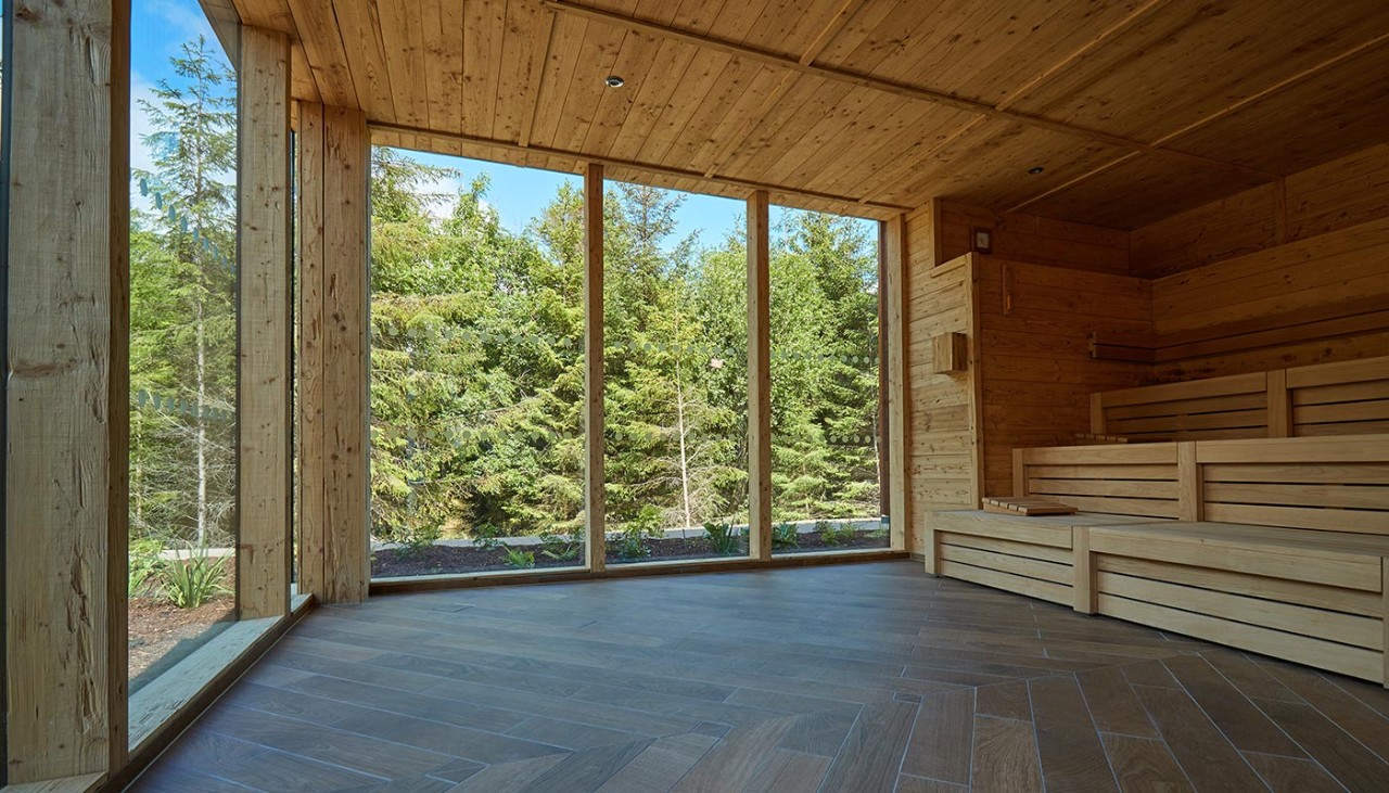 Wooden Nordic Sauna with views out to the surrounding forest.