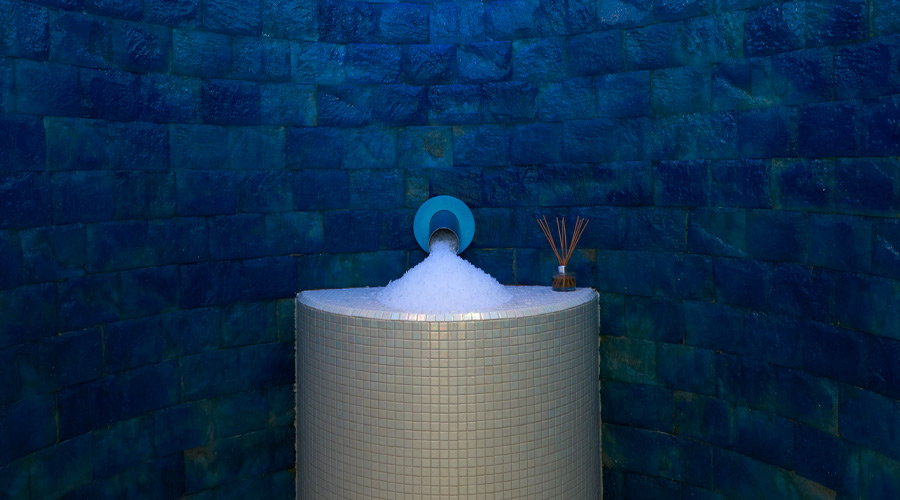 Ice room with a fountain on the wall creating shaved ice.