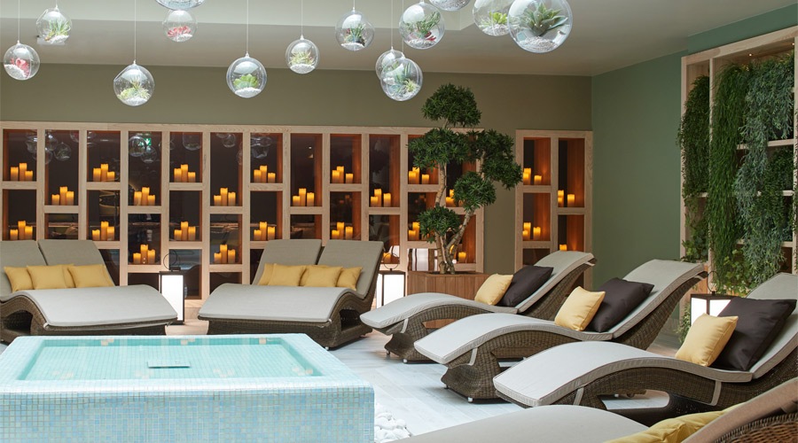 Reclined chairs surrounded by a shallow pool