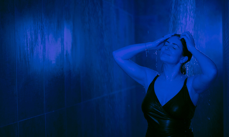 Woman soaking in the Thunder and Rain Shower.