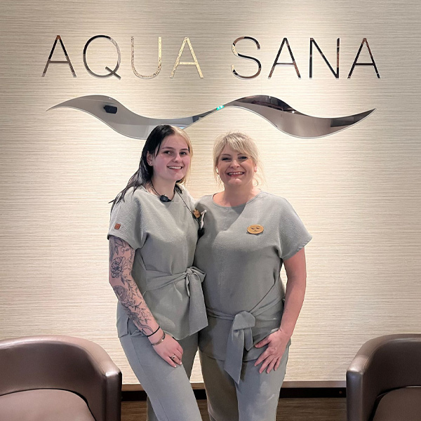 Two Aqua Sana staff members standing in the entrance of the spa.