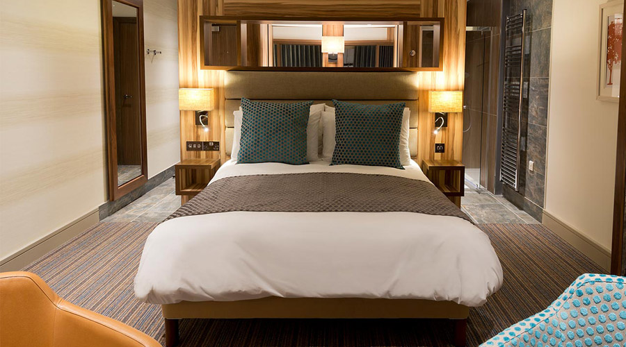 double bed in spa apartment