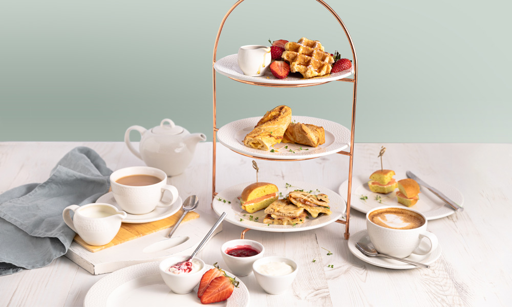 a selection of pastries, with 2 cups of coffee