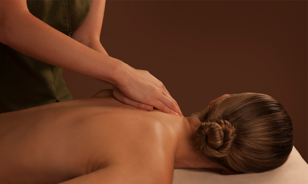 woman receiving massage on back area  