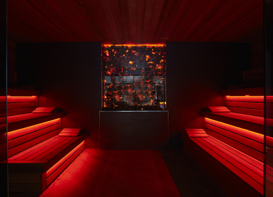 lava sauna with red lighting and tiered benches