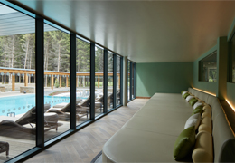 Lounge bed looking out to an outdoor pool