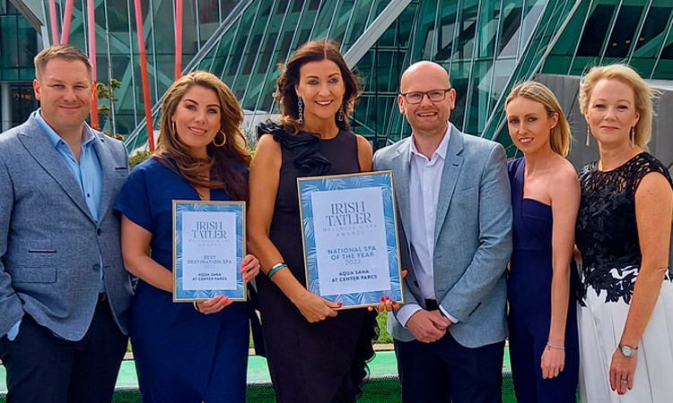 Group of Aqua Sana staff members holding a Tatler award