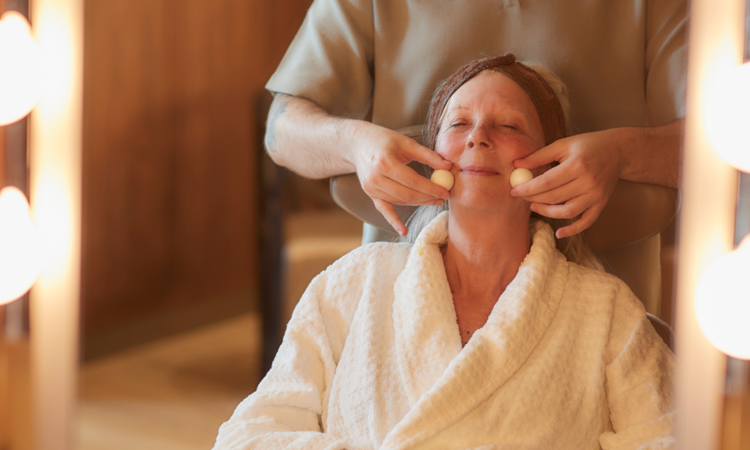 Woman having a relaxing facial massage.