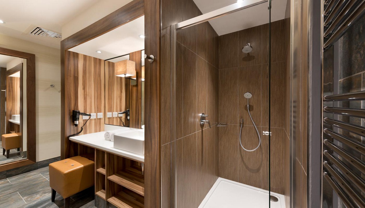 Bathroom with vanity and a shower cubicle. 