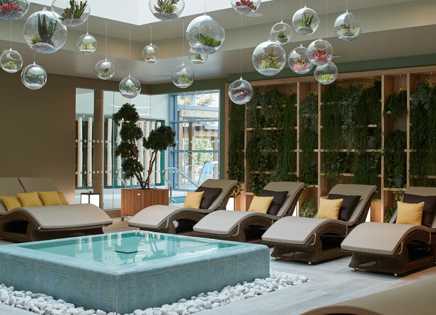 water feature surrounded by lounge chairs