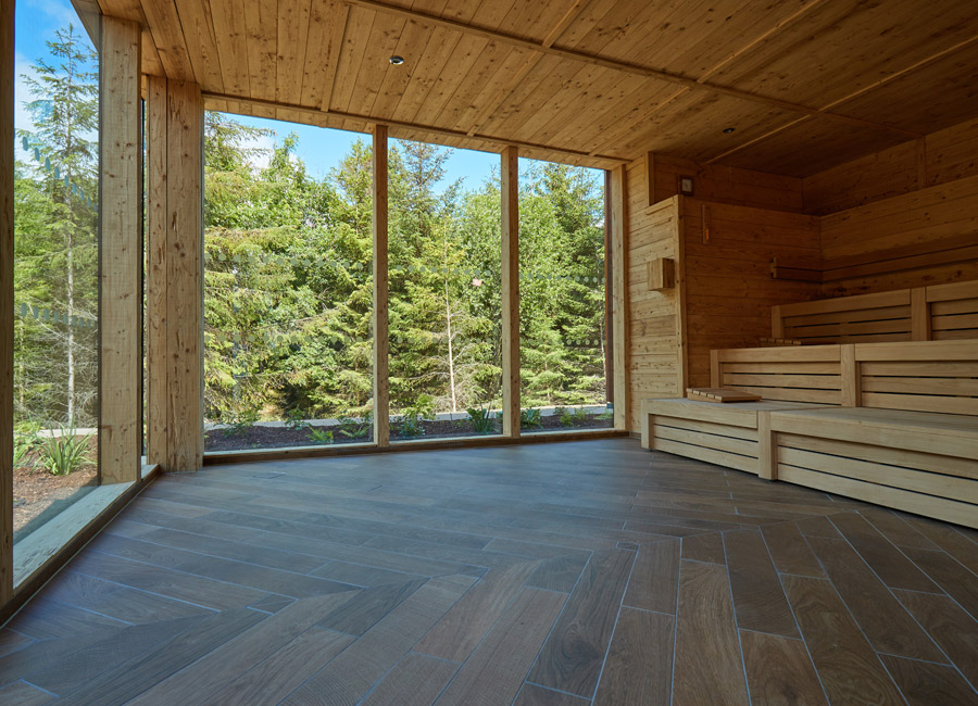 wooden sauna with view of forest