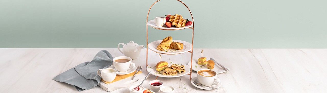 a selection of pastries, with 2 cups of coffee