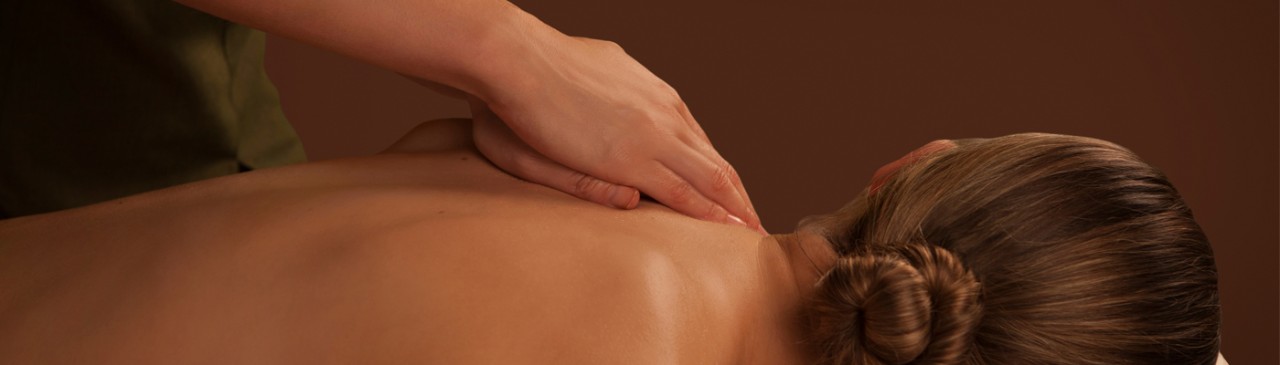 women receiving massage on back area