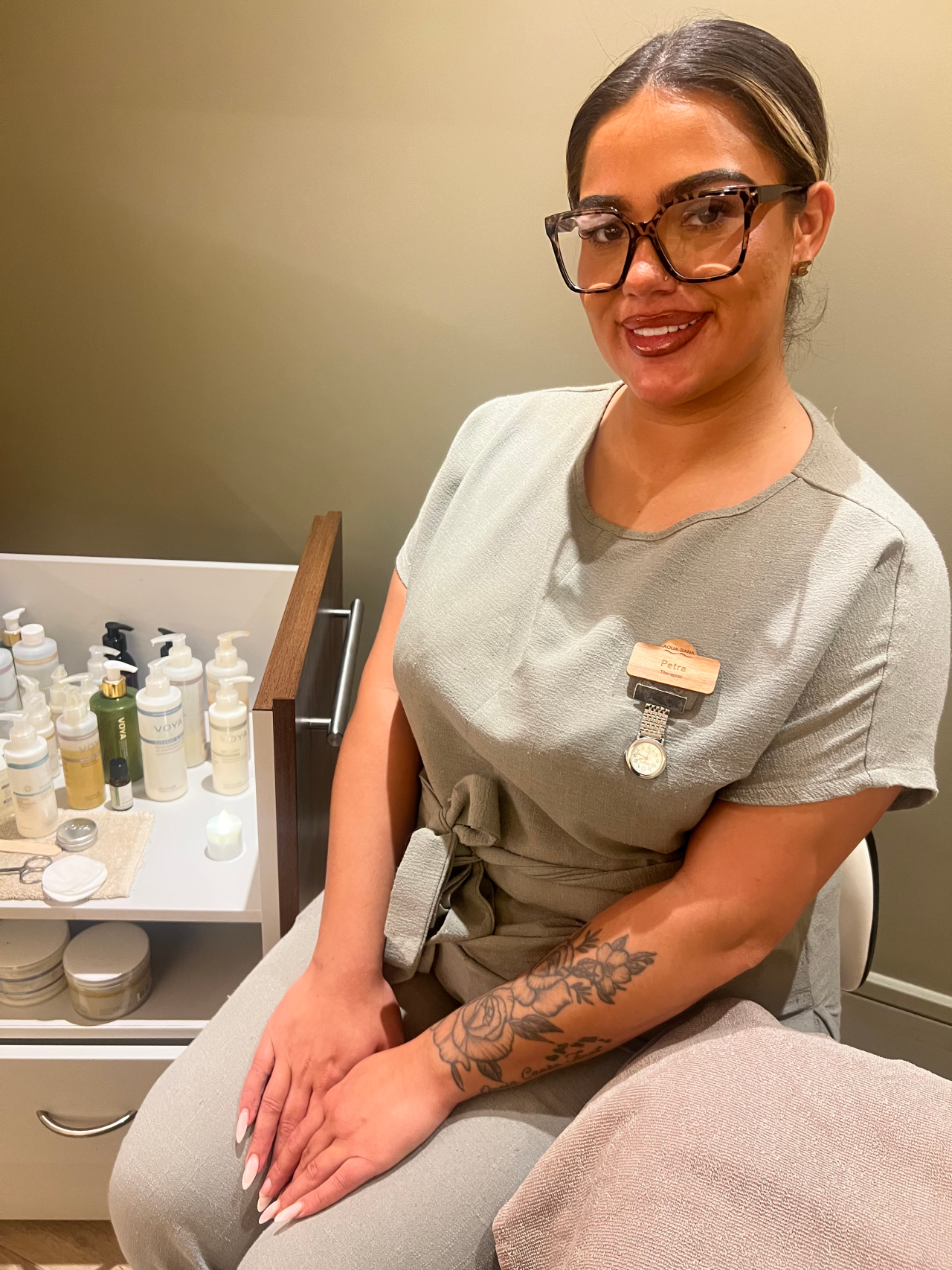 Spa therapist sitting in the Treatment area.