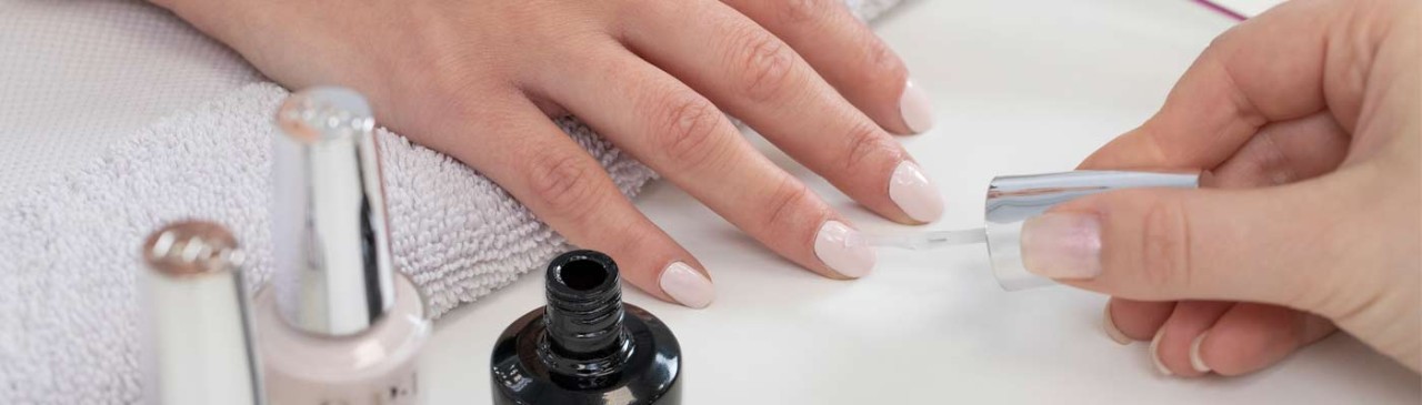 hand with nails being painted