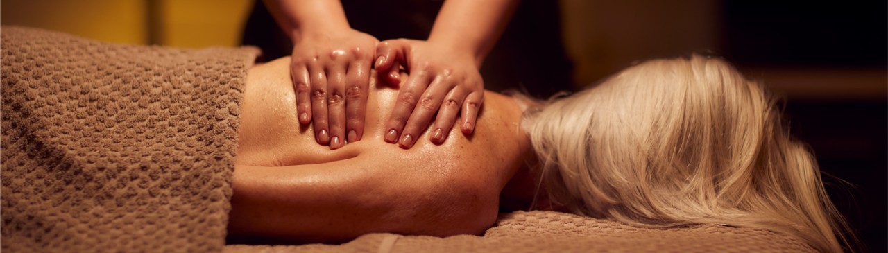 women receiving a back massage