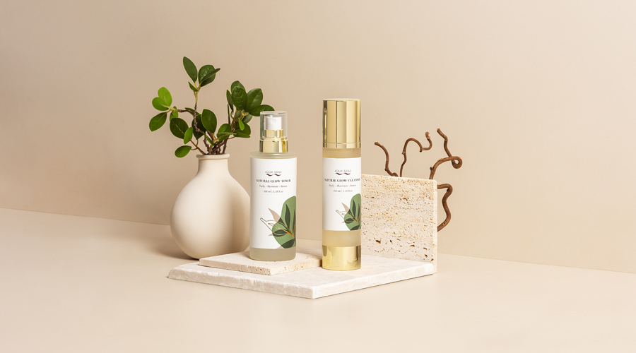 Natural glow products lined up with decorative foliage.