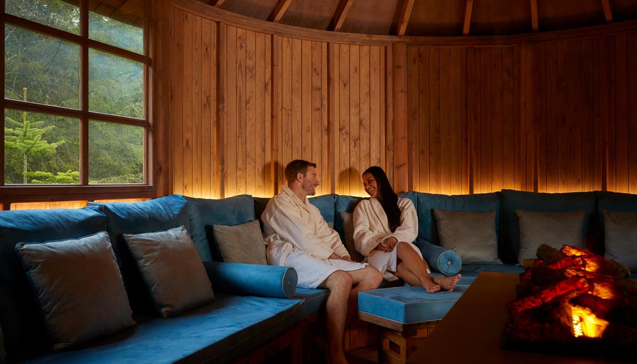 Couple snuggled up inside the Scandinavian Snug.