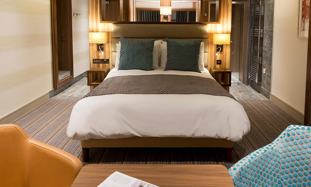 Inside our Spa Break APartment with glowing lamps and soft furnishings.