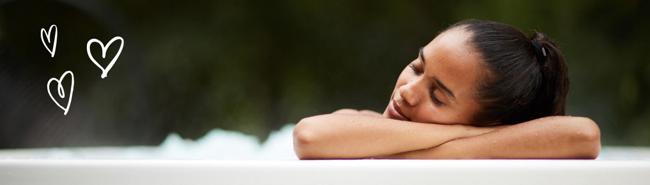 women leaning on the edge of the hot tub
